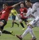 Rafael bloquea un disparo de Cristiano Ronaldo en el partido de ida de los octavos de final de la Champions League