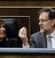 El presidente del Gobierno, Mariano Rajoy, conversa con la vicepresidenta, Soraya Sáenz de Santamaría, poco antes de intervenir hoy en el Congreso de los Diputados en su primer debate sobre el estado de la nación al frente del Ejecutivo