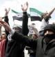 Varios sirios residentes en Jordania participan en una marcha contra el presidente sirio, Bachar Al Asad