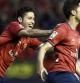 El jugador de Osasuna, Álvaro Cejudo (d), recibe la felicitación de su compañero Damiá Abella (i), tras conseguir el gol de la victoria ante el Sevilla durante el encuentro que ambos equipos han disputado esta noche en el Estadio Reyno de Navarra en la penúltima jornada del campeonato de liga