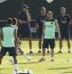 Los tres entrenadores Tito Vilanova, Jordi Roura y Joan Francesc Ferrer "Rubí" observan a sus jugadores durante el primer entrenamiento de la temporada