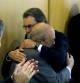 El presidente de la Generalitat y de CiU, Artur Mas, abraza al expresidente Jordi Pujol, en presencia de los dirigentes convergentes, Francesc Homs y Lluís María Corominas (d), a su llegada a la reunión con carácter extraordinario de la ejecutiva de CDC