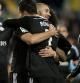 Benzema y Cristiano Ronaldo celebran el primer gol del Real Madrid al Málaga