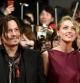 El actor estadounidense Johnny Depp, junto a su pareja, la actriz estadounidense Amber Heard, a su llegada al estreno de la película 'Mortdecai', en Tokio