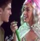 La cantante Katy Perry hace subir al escenario a un fan de Mataró durante el concierto en el Palau Sant Jordi de Barcelona