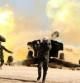 Milicianos chiítas que luchan junto al ejército iraquí disparan un cañçon de artillería en las cercanías de la ciudad de Tikrit, dominada por el Estado Islámico