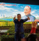 A man poses in front of a billboard featuring China's late paramount leader Deng Xiaoping on the eve of the 40th anniversary of the country's "reform and opening up" policy in Shenzhen on December 17, 2018. - China celebrates on December 18 the 40th anniversary of its transformative "reform and opening up" policy, which turned the world's most populous country into an economic juggernaut that now faces slowing growth and a stern US challenge. (Photo by Nicolas ASFOURI / AFP)