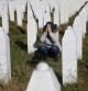 A woman reacts near a grave of her family members in the Memorial centre Potocari near Srebrenica, Bosnia and Herzegovina, after the court proceedings of former Bosnian Serb general Ratko Mladic, November 22, 2017. REUTERS/Dado Ruvic