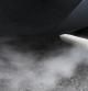 Humo expulsado por el tubo de escape de un coche