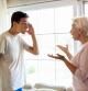 Mother and her teenage son arguing at home
