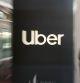 (FILES) In this file pan zoom image, an Uber logo is seen outside the company's headquarters in San Francisco, California on May 8, 2019. - Uber said May 6, 2020 it was cutting 3,700 jobs amid a huge slump in its ride-hailing operations during the pandemic.The cuts amount to around 14 percent of Uber's global workforce, which does not include its contract drivers.The company made the announcement in a regulatory filing, which also said chief executive Dara Khosrowshahi would waive his base salary for the remainder of the year. (Photo by Josh Edelson / AFP)