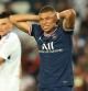 PARIS, FRANCE - AUGUST 14: Kylian Mbappe of Paris Saint-Germain  looks on  during the Ligue 1 Uber Eats match between Paris Saint Germain and Strasbourg at Parc des Princes on August 14, 2021 in Paris, France. (Photo by David Rogers/Getty Images)