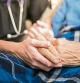 A stock photo of a Hospice Nurse visiting an Elderly male patient who is receiving hospice/palliative care.