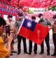 A group of soldiers takes photos at a square decorated with Taiwan flags ahead of the national day celebration in Taoyuan, Taiwan, October 8, 2021. REUTERS/Ann Wang