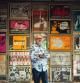 Lorenzo Rodríguez, fundador de la sala Rock-ola de Madrid, posa frente a los carteles de la exposición dedicada a su 40 aniversario, en Úbeda, organizada por el colectivo Peor para el Sol y la Fundación Huerta de San Antonio