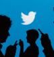 FILE PHOTO: People holding mobile phones are silhouetted against a backdrop projected with the Twitter logo in this illustration picture taken in Warsaw September 27, 2013. REUTERS/Kacper Pempel/File Photo