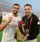 Sadd's coach Xavi (R) and Sadd's midfielder Hassan al-Haydos celebrate with the trophy after winning the Amir Cup final football match between Al-Sadd and Al-Rayyan at the Al-Thumama Stadium in the capital Doha on October 22, 2021. (Photo by KARIM JAAFAR / AFP)