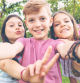 Best friends taking selfie outdoors in backyard – happy friendship with smart kids having fun celebrating summer vacation – modern children enjoying time together at garden party playing and smiling