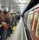 People waiting on the platform at Embankment underground station, London, UK. This public transport tube station is on the District and Circle lines from this platform. (Photo by In Pictures Ltd./Corbis via Getty Images)
