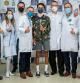 Former Tour de France winner Egan Bernal poses for a photo with the medical team of the Clinica Universidad de la Sabana, after discharging him following several operations to which he was subjected after suffering an accident while training on Colombian roads, in Chia, Colombia February 6, 2022. Courtesy of Sabana University Clinic/Handout via REUTERS ATTENTION EDITORS - THIS IMAGE WAS PROVIDED BY A THIRD PARTY. NO RESALES. NO ARCHIVES. MANDATORY CREDIT