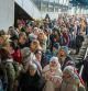 People crowd as they try to get on a train to Lviv at the Kyiv station, Ukraine, Friday, March 4. 2022. Ukrainian men have to stay to fight in the war while women and children are leaving the country to seek refuge in a neighboring country. (AP Photo/Emilio Morenatti)