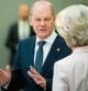 German Chancellor Olaf Scholz (L) speaks with European Commission President Ursula von der Leyen during a meeting of the G7 group of advanced economies and the European Union and an extraordinary NATO summit at the NATO headquarters in Brussels on March 24, 2022. (Photo by Michael Kappeler / POOL / AFP)