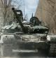 FILE PHOTO: A Ukrainian service member drives a captured Russian T-72 tank, in the recently liberated village of Lukianivka, in Kyiv region, Ukraine March 27, 2022. REUTERS/Serhii Nuzhnenko/File Photo