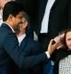 Paris Saint-Germain's Qatari president Nasser Al-Khelaifi (L) smiles next to Minsiter of sport Roxana Maracineanu prior the French L1 football match between Paris Saint-Germain (PSG) and Olympique de Marseille (OM) at the Parc des Princes stadium in Paris on April 17, 2022. (Photo by FRANCK FIFE / AFP)