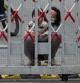A resident and a child look out through gaps in the barriers at a closed residential area during lockdown, amid the coronavirus disease (COVID-19) pandemic, in Shanghai, China, May 10, 2022. REUTERS/Aly Song      TPX IMAGES OF THE DAY
