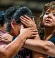 TOPSHOT - A woman cries as she attends the vigil for the victims of the mass shooting at Robb Elementary School in Uvalde, Texas on May 25, 2022. - The tight-knit Latino community of Uvalde was wracked with grief Wednesday after a teen in body armor marched into the school and killed 19 children and two teachers, in the latest spasm of deadly gun violence in the US. (Photo by CHANDAN KHANNA / AFP)