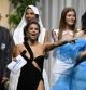 US actress Eva Longoria (fronL) and US-Ukrainian actress Milla Jovovich (R) conduct an auction on May 26, 2022 flanked by Fernando Casablancas (L), French model Noemie Lenoir and Russian model Valery Kaufman (2ndR) during the annual amfAR Cinema Against AIDS Cannes Gala at the Hotel du Cap-Eden-Roc in Cap d'Antibes, southern France, on the sidelines of the 75th Cannes Film Festival. (Photo by Stefano Rellandini / AFP)