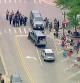 Police deploy after gunfire erupted at a Fourth of July parade route in the wealthy Chicago suburb of Highland Park, Illinois, U.S. July 4, 2022 in a still image from video. ABC affiliate WLS/ABC7 via REUTERS NO RESALES. NO ARCHIVES. MANDATORY CREDIT