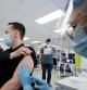 FILE PHOTO: A man is vaccinated at a monkeypox vaccination clinic run by CIUSSS public health authorities in Montreal, Quebec, Canada, June 6, 2022. REUTERS/Christinne Muschi/File Photo