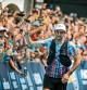 Spain's Kilian Jornet celebrates as he crosses the finish line and wins the 19th edition of the Ultra Trail du Mont Blanc (UTMB) a 171km trail race crossing France, Italy and Switzerland in Chamonix, south-eastern France on August 27, 2022. - The Spanish ultra trail star Kilian Jornet was victorious in the fourth Ultra-Trail du Mont-Blanc (UTMB) of his career, setting a new record time of under twenty hours. (Photo by JEFF PACHOUD / AFP)