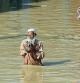 Nowshera (Pakistan), 29/08/2022.- People wade through a flooded area following heavy rains in Nowshera District, Khyber Pakhtunkhwa province, Pakistan, 29 August 2022. According to the National Disaster Management Authority (NDMA) on 27 August, flash floods triggered by heavy monsoon rains have killed over 1,000 people across Pakistan since mid-June 2022. More than 33 million people have been affected by floods, the country's climate change minister said. (Inundaciones) EFE/EPA/BILAWAL ARBAB