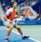 TOPSHOT - Carlos Alcaraz from Spain reacts during his fourth round 2022 US Open Tennis tournament men#{emoji}146;s singles match against Marin Cilic from Croatia at the USTA Billie Jean King National Tennis Center in New York on September 5, 2022. (Photo by COREY SIPKIN / AFP)