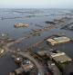 FILE - Homes are surrounded by floodwaters in Sohbat Pur city, a district of Pakistan's southwestern Baluchistan province, Aug. 29, 2022. Loss and damage is the human side of a contentious issue that will likely dominate climate negotiations in Egypt. Extreme weather is worsening as the world warms, with a study calculating that human-caused climate change increased Pakistan’s flood-causing rain by up to 50%. (AP Photo/Zahid Hussain, File)