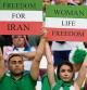 Iranian soccer fans hold up signs reading Woman Life Freedom and Freedom For Iran, prior to the World Cup group B soccer match between England and Iran at the Khalifa International Stadium in in Doha, Qatar, Monday, Nov. 21, 2022. (AP Photo/Alessandra Tarantino)