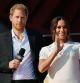 (FILES) In this file photo taken on September 25, 2021, Britain's Prince Harry and Meghan Markle, Duchess of Sussex, speak during the 2021 Global Citizen Live festival at the Great Lawn, Central Park in New York City. - Prince Harry will release his memoir in January, his publisher said Thursday, with the highly-anticipated account of life in the monarchy and after he quit royal duties landing just four months after the death of Queen Elizabeth II. (Photo by Angela Weiss / AFP)
