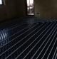 underfloor heating in a house with heating elements embedded in a floor
