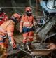 Men at work in the construction site of a tunnel for the TAV high-speed train line (Treno Alta Velocita) between Lyon and Turin, in Saint-Julien-Montdenis, southeastern France, on January 18, 2023. (Photo by MARCO BERTORELLO / AFP)