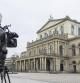A TV cameraman films the State Opera in Hanover, Germany, Monday, Feb. 13, 2023. A German newspaper critic had animal feces smeared on her face by a ballet director in the city of Hannover after he apparently accused her of driving away ticket holders. The Hannover state theater apologized for the incident on Saturday and said Monday that it was suspending ballet director Marco Goecke with immediate effect. (Julian Stratenschulte/dpa via AP)