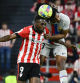 Athletic Bilbao's Inaki Williams, left, jumps for a header with Barcelona's Jules Kounde during the Spanish La Liga soccer match between Athletic Club and Barcelona at the San Mames stadium in Bilbao, Spain, Sunday, March 12, 2023. (AP Photo/Alvaro Barrientos)