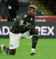 SHEFFIELD, ENGLAND - DECEMBER 17: Paul Pogba of Manchester United takes a knee in support of the Black Lives Matter movement ahead of the Premier League match between Sheffield United and Manchester United at Bramall Lane on December 17, 2020 in Sheffield, England. The match will be played without fans, behind closed doors as a Covid-19 precaution. (Photo by Rui Vieira - Pool/Getty Images)