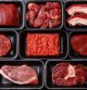 Different types of meat in plastic boxes packaging tray