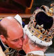 Britain's Prince William, Prince of Wales kisses his father, Britain's King Charles III, wearing St Edward's Crown, during the King's Coronation Ceremony inside Westminster Abbey in central London on May 6, 2023. - The set-piece coronation is the first in Britain in 70 years, and only the second in history to be televised. Charles will be the 40th reigning monarch to be crowned at the central London church since King William I in 1066. Outside the UK, he is also king of 14 other Commonwealth countries, including Australia, Canada and New Zealand. Camilla, his second wife, will be crowned queen alongside him and be known as Queen Camilla after the ceremony. (Photo by Yui Mok / POOL / AFP)