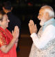 India's Prime Minister Narendra Modi (R) is greeted as he arrives at the Sydney international airport on May 22, 2023, to begin his three-day official visit to Australia. (Photo by David Gray / POOL / AFP)