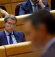 FILE PHOTO: Spain's opposition People's Party (PP) leader Alberto Nunez Feijoo listens to Spain's Prime Minister Pedro Sanchez speak during a session at the Spanish Senate in Madrid, Spain, September 6, 2022. REUTERS/Susana Vera/File Photo