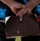 Erasmo Villavicencio holds his bible while he protests against attendees at an all ages LGBTQ Pride event across the street, in Franklin, Tennessee, U.S., June 3, 2023.   REUTERS/Kevin Wurm
