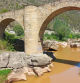 Agua de color chocolate bajo el Pont de Vilomara.
